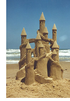 Grand Sandcastle: A display of how interstitial liquids cause granular media to take remarkable shapes